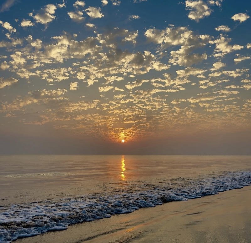 Soft cloudy sky above sea creating ocean aesthetic pfp mood